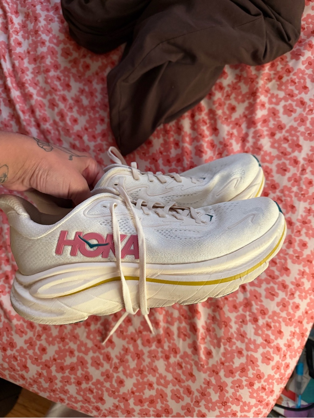 Hoka One One White Athletic Sneakers with Pink Logo and Yellow Trim